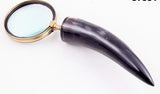 Elegant magnifier glass ornament, handcrafted from metal and horn, measuring 10x10x32 cm, perfect for home decor and functionality.