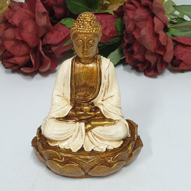 Buddha figurine seated on a lotus flower, symbolizing tranquility and mindfulness, perfect for decor and meditation spaces.