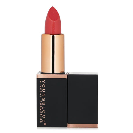 Vibrant Coral Beach lipstick by Youngblood, enriched with natural oils and Candelila Wax for hydration and long-lasting color.