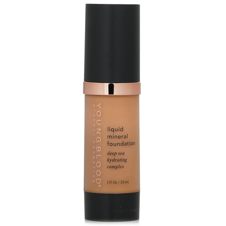 Youngblood Liquid Mineral Foundation in Suntan, 30ml, offers sheer coverage, moisture, and a radiant finish for all skin types.