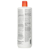 Paul Mitchell Color Care shampoo, 1000ml, gently cleanses color-treated hair, boosting strength, moisture, and shine.