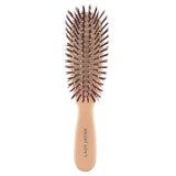 Purse-sized Lady Jayne detangling brush for smooth, frizz-free hair, suitable for all hair types, available in stylish colors.