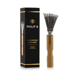 Philip B Hairbrush Cleaner featuring a stainless steel design and oak handle, removes hair and buildup for effective brush care.