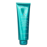 Luxurious Kerastase shampoo with a jelly-like texture revitalizes very damaged hair, enhancing strength and shine while repairing fibers.