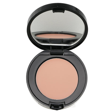 Bobbi Brown Corrector in Light Bisque, designed to conceal dark circles with a creamy, blendable, and waterproof formula.