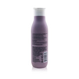 Luxurious sulfate-free shampoo for dry/damaged hair, replenishes moisture, enhances shine, and safe for color-treated hair.