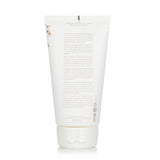 Hydrating self-tanning milk for face and body, enriched with DHA, shea butter, and fruit extracts for a natural glow.