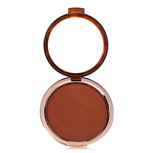 Estee Lauder Bronze Goddess Powder Bronzer #04 Deep in compact, offering a sun-kissed glow for face and body. 21g, lightweight formula.