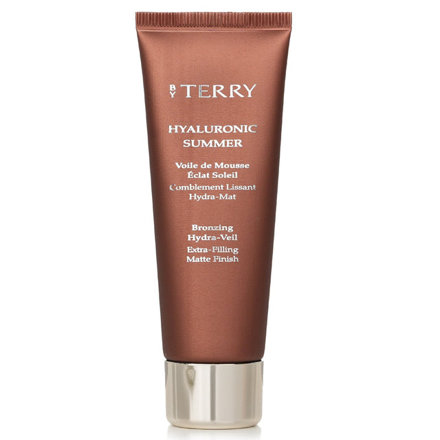 Hydrating bronzing fluid by By Terry for a natural glow, featuring hyaluronic acid and micro-dispersed mineral pigments.