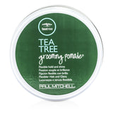 Paul Mitchell Tea Tree Grooming Pomade in a sleek 85g jar, ideal for flexible hold, shine, and wavy or curly hair.