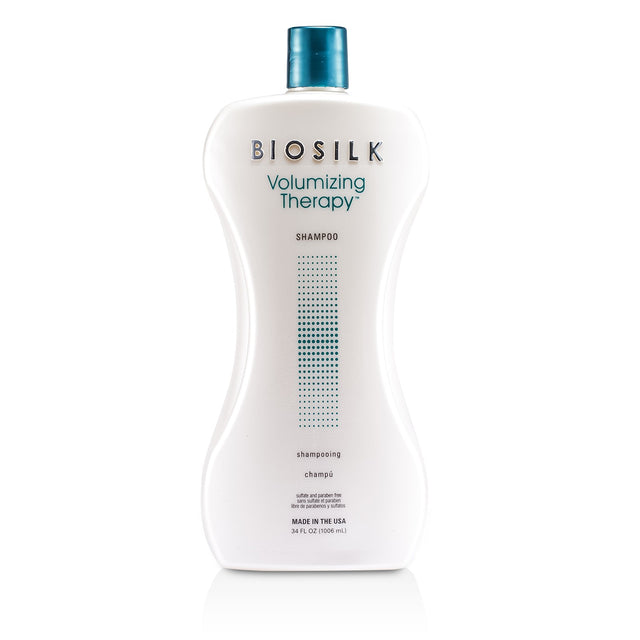 Silk-infused BioSilk Volumizing Therapy Shampoo in 1006ml offers hydration, volume, and UV protection for vibrant, healthy hair.