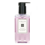 Luxurious Jo Malone Red Roses Body & Hand Wash with pump, 250ml, infused with fresh rose fragrance for soft, cleansed skin.