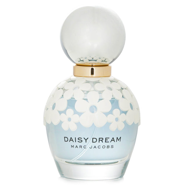 A 50ml bottle of Marc Jacobs Daisy Dream Eau De Toilette, featuring floral fruity notes perfect for spring and summer.