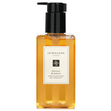 Luxurious Jo Malone Orange Blossom hand wash with pump, 250ml, offers refreshing citrus scent and rich foaming lather for all skin types.