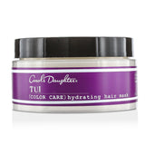 Hydrating hair mask for color-treated hair with cacao butter, olive oil, and Maurita fruit oils for softness and shine.