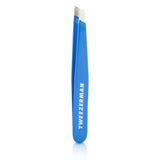 Bahama Blue Mini Slant Tweezer by Tweezerman, offering precision in a portable design for effortless grooming.