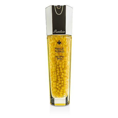 Guerlain Abeille Royale Daily Repair Serum in a 30ml bottle, featuring honey and royal jelly for youthful, radiant skin.