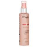 Kerastase Discipline Fluidissime anti-frizz spray for unruly hair, providing thermal protection and enhancing shine.