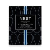 Scented candle in a decorative vessel, featuring Ocean Mist & Sea Salt scent, ideal for creating a calming ambience.