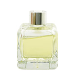 Elegant glass cube diffuser with Orange Cinnamon fragrance, featuring engineered polymer sticks for optimal scent diffusion.