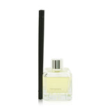 Elegant glass cube diffuser with orange and cinnamon scent, featuring engineered polymer sticks for optimal fragrance diffusion.