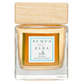 Elegant 200ml home fragrance diffuser in glass, wooden cap, inspired by Italian landscapes, refreshing and sophisticated scent.