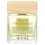 Elegant glass diffuser with wooden cap, infusing spaces with refreshing orange garden scent and enhancing ambiance.