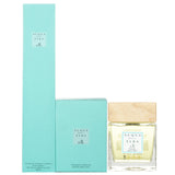 Elegant glass diffuser with wooden cap, delivering a refreshing citrus scent reminiscent of a sunlit orange garden.