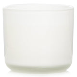 Eco-luxury candle in glass, infused with coconut and lime scents for a blissful ambiance and lasting 50-hour burn time.