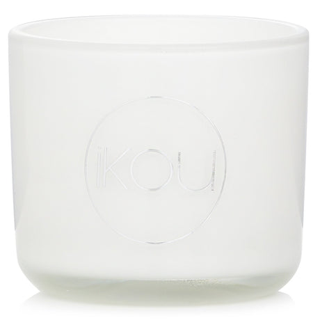 Eco-luxury natural wax candle in glass, featuring uplifting scents of Italian Orange, Cardamom, and Vanilla, 50-hour burn time.
