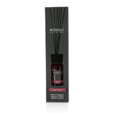 Millefiori Grape Cassis diffuser in a chic glass bottle, featuring dark wooden sticks for a vibrant home aroma.