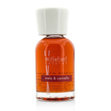 Millefiori Natural Fragrance Diffuser with apple and cinnamon scent in a sleek glass bottle, enhancing home ambiance.