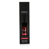 Millefiori Natural Fragrance Diffuser in stylish glass bottle, infusing apple and cinnamon scents for a warm home ambiance.