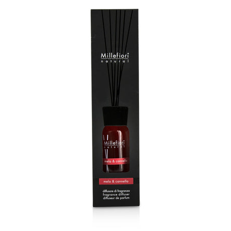 Millefiori Natural Fragrance Diffuser in stylish glass bottle, infusing apple and cinnamon scents for a warm home ambiance.