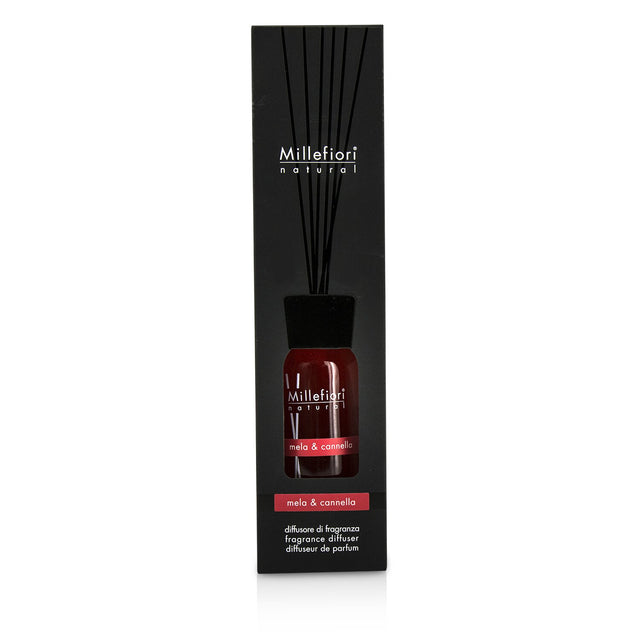 Millefiori Natural Fragrance Diffuser in stylish glass bottle, infusing apple and cinnamon scents for a warm home ambiance.