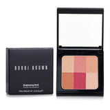 Bobbi Brown Brightening Brick in #06 Cranberry, 6.6g, enhances cheeks with a sun-kissed glow and velvety texture for easy application.