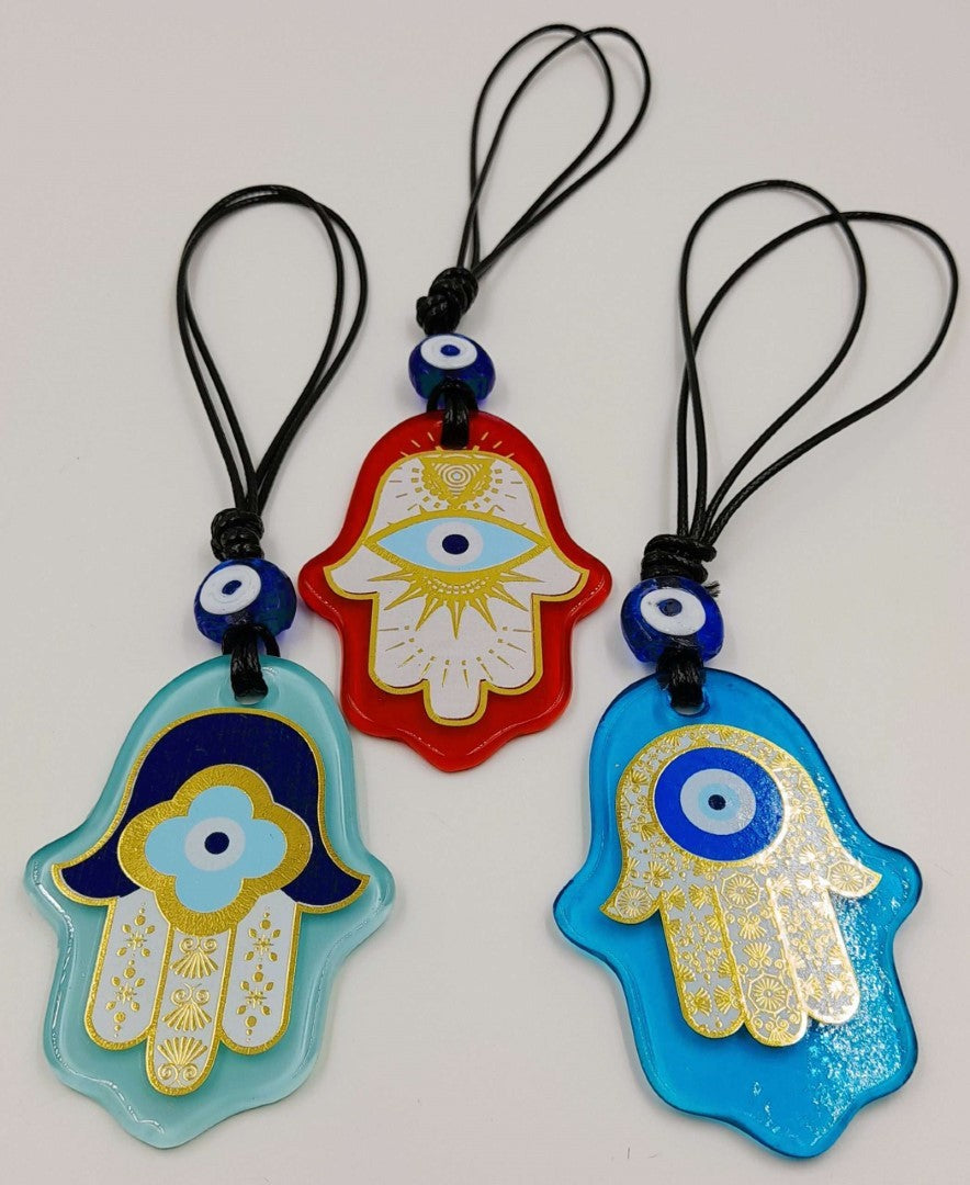 Set of 3 Turkish glass Hamsa wall hangings featuring vibrant designs, symbolizing protection and good luck.