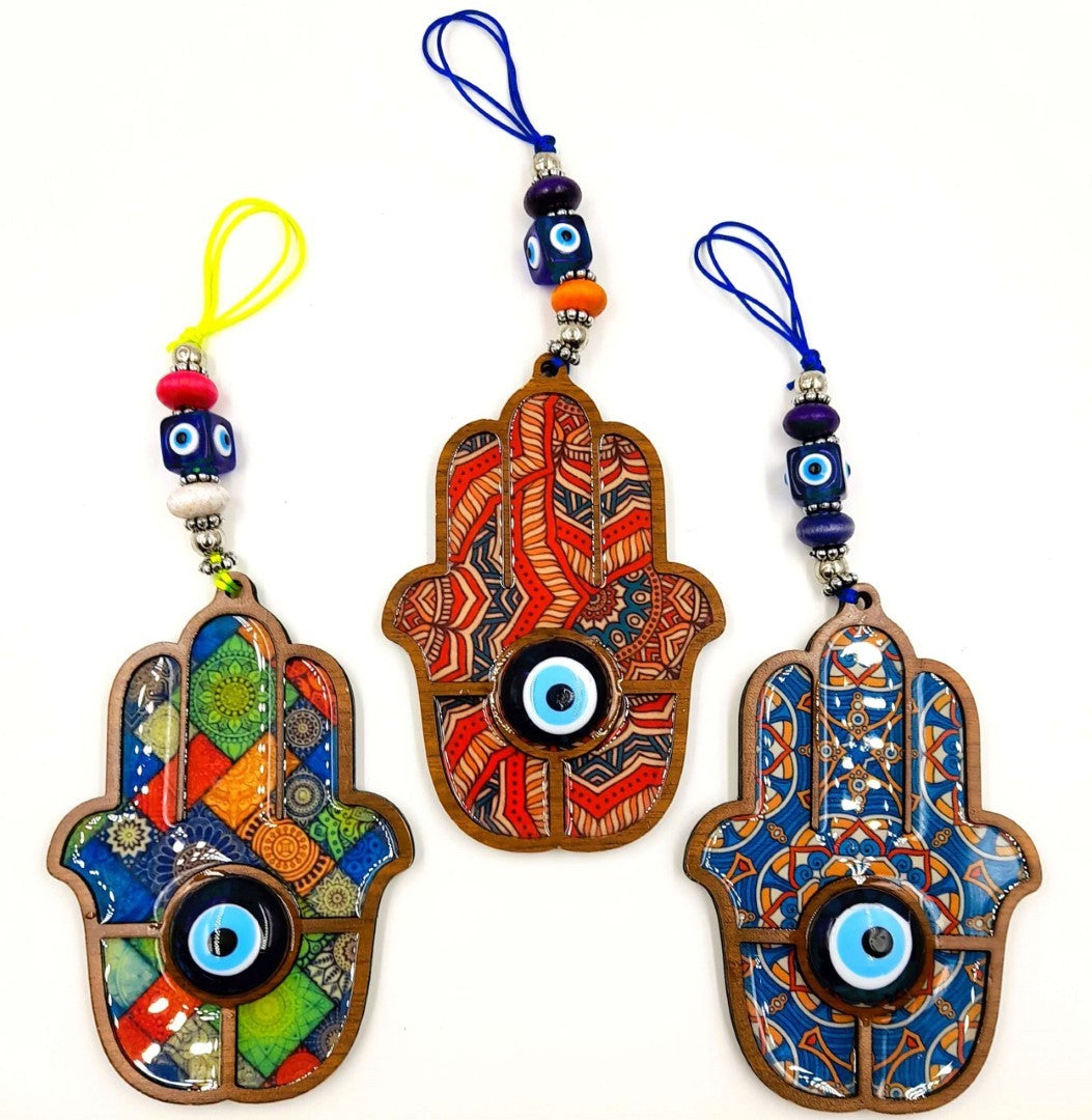 Boho Hamsa Hand wall hangings with glass evil eyes, set of 3, showcasing unique designs and vibrant colors for decor.