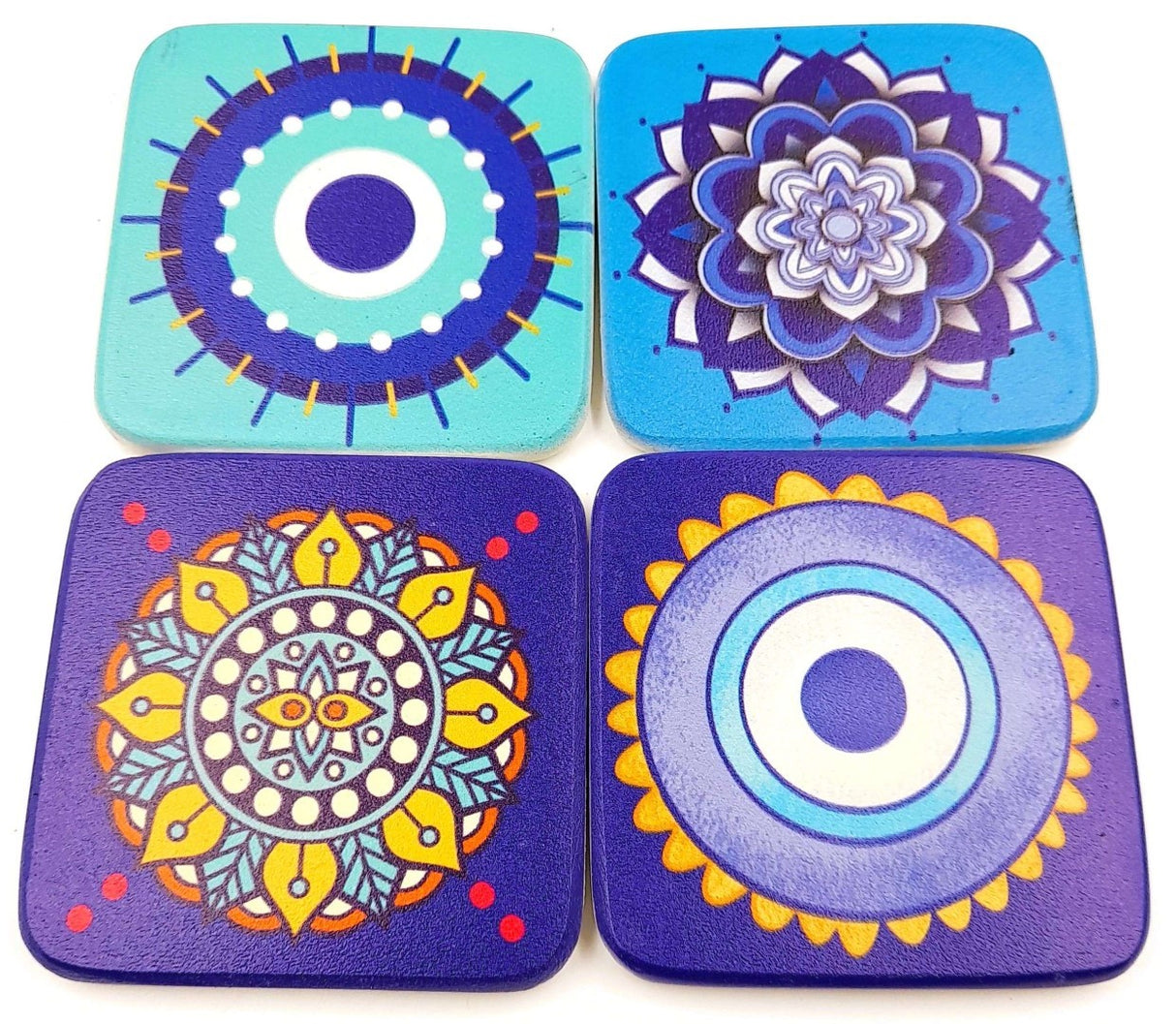 Set of 2 handmade Evil Eye coasters, 9cm, featuring vibrant assorted designs for home decor and surface protection.