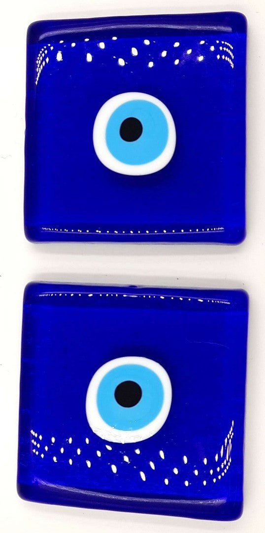 Set of 2 glass blocks featuring an evil eye motif, designed for stylish home decor and protection against negativity.