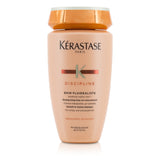 Sulfate-free shampoo for unruly hair, enhancing fluidity, shine, and manageability while reducing frizz.
