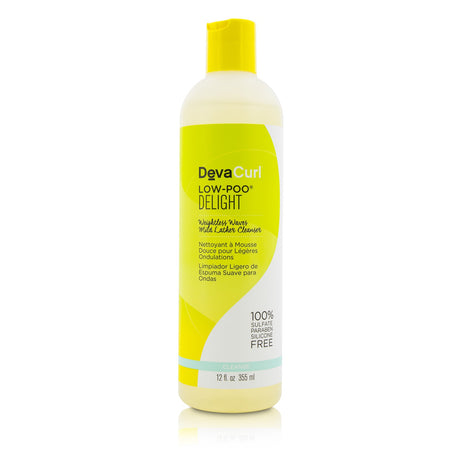 DevaCurl Low-Poo Delight shampoo bottle, designed for wavy hair with a citrus floral scent and nourishing ingredients for bounce.