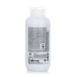 Leave-in treatment for coarse or frizzy hair, enriched with olive extract for nourishment, hydration, and a citrus scent.