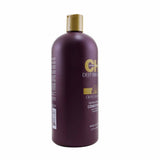 Transformative 946ml conditioner with Olive & Monoi Oils for soft, smooth, and healthy hair, ideal for dry or damaged strands.