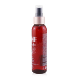 CHI Rose Hip Oil Leave-In Tonic for color-treated hair, enhancing shine, moisture, and manageability without rinsing.