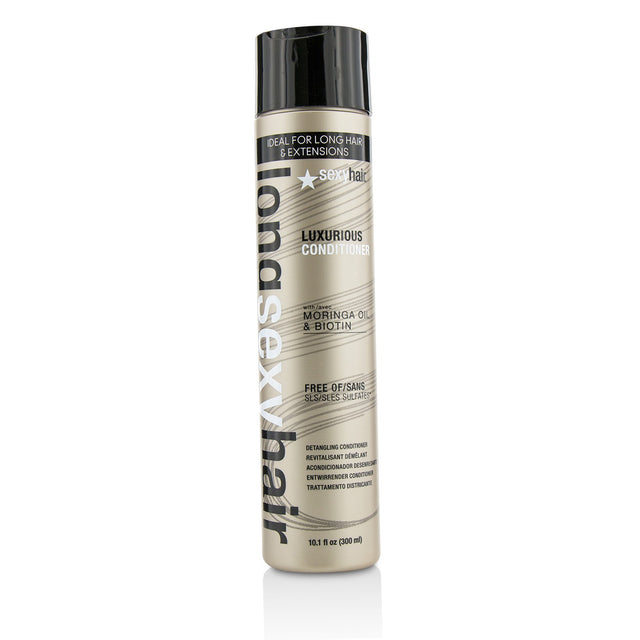 Luxurious detangling conditioner for long hair, enriched with Moringa Oil and Biotin for softness and shine.