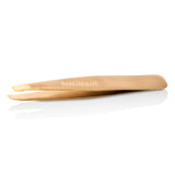 Rose gold Tweezerman Slant Tweezer featuring precision slanted tips for effortless hair removal and grooming.