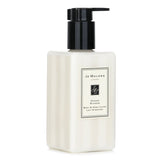 Luxurious Jo Malone Orange Blossom Body & Hand Lotion with pump, 250ml; hydrates skin while enveloping it in citrus fragrance.