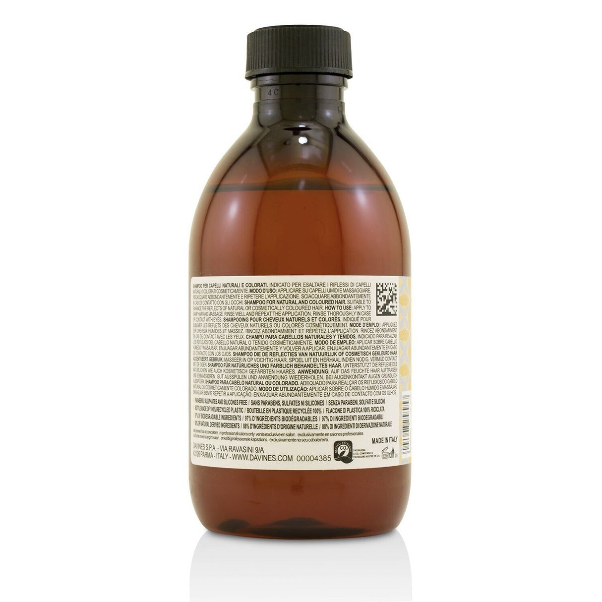 Golden-hued Davines Alchemic Shampoo for natural and colored hair, enhancing blonde tones with moisturizing ingredients.