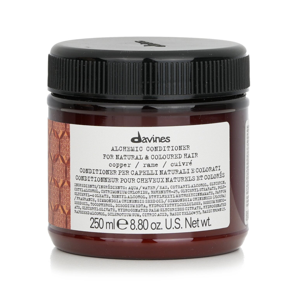 Copper-hued Davines Alchemic Conditioner for enhanced color and shine in natural and colored hair, enriched with milk proteins.